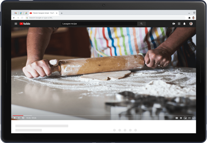 Pixelbook laptop showing video of a person rolling dough with a rolling pin, and showing that the same video is being cast to a TV screen.
